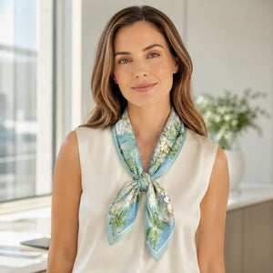 Woman wearing a floral scarf around her neck in an indoor setting